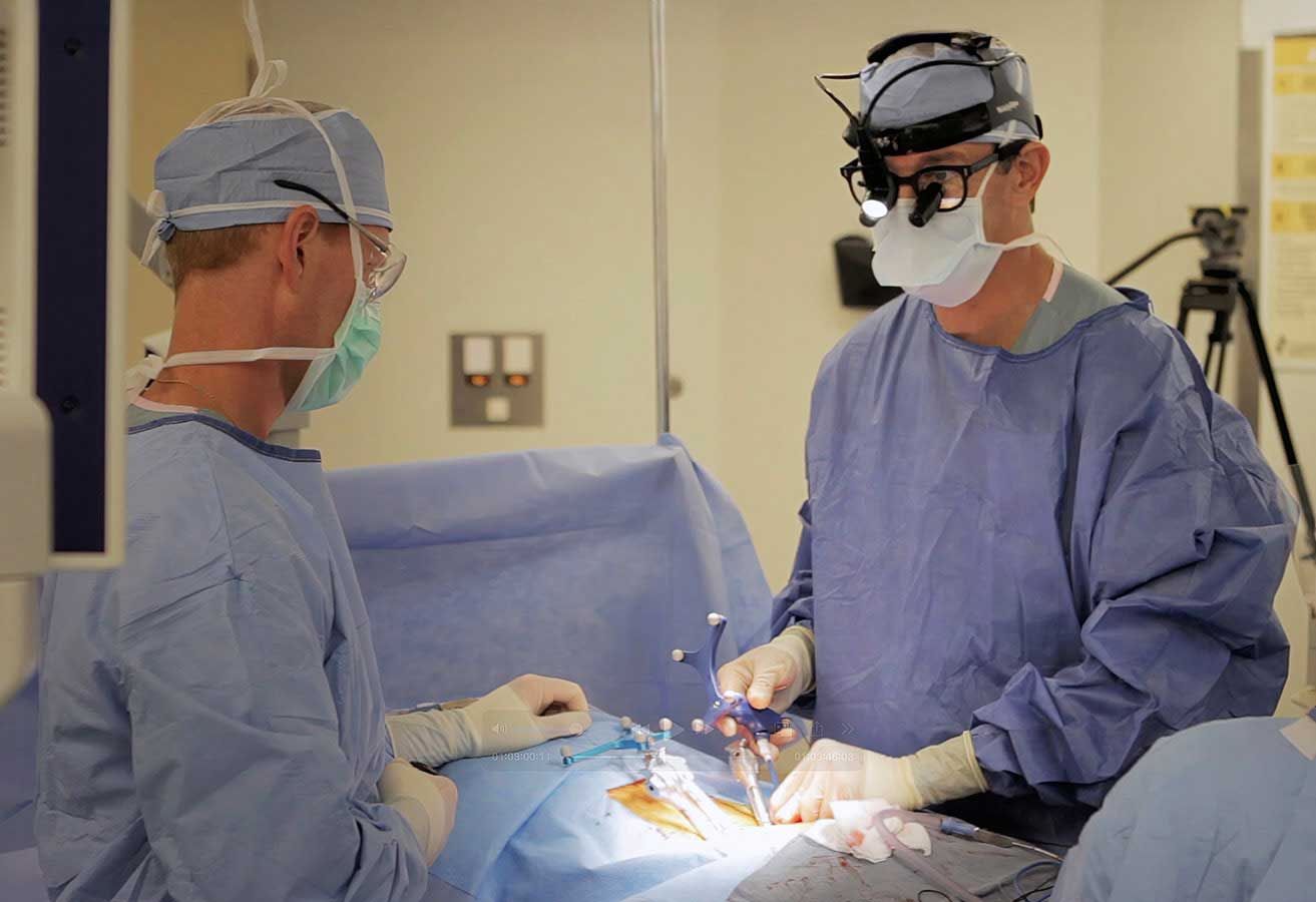 Brain surgeons performing a procedure on a patient. 
